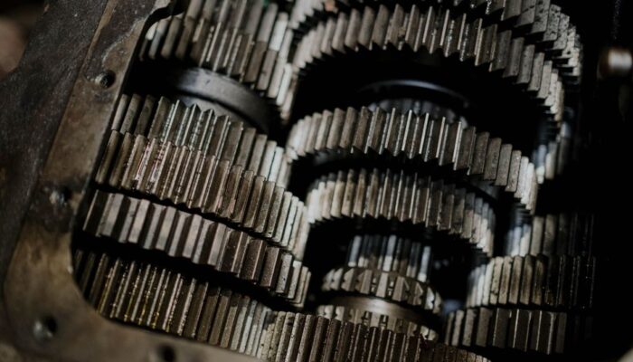 Detailed shot of mechanical gears showcasing intricate steel parts and engineering precision. - Photo by cottonbro studio on Pexels
